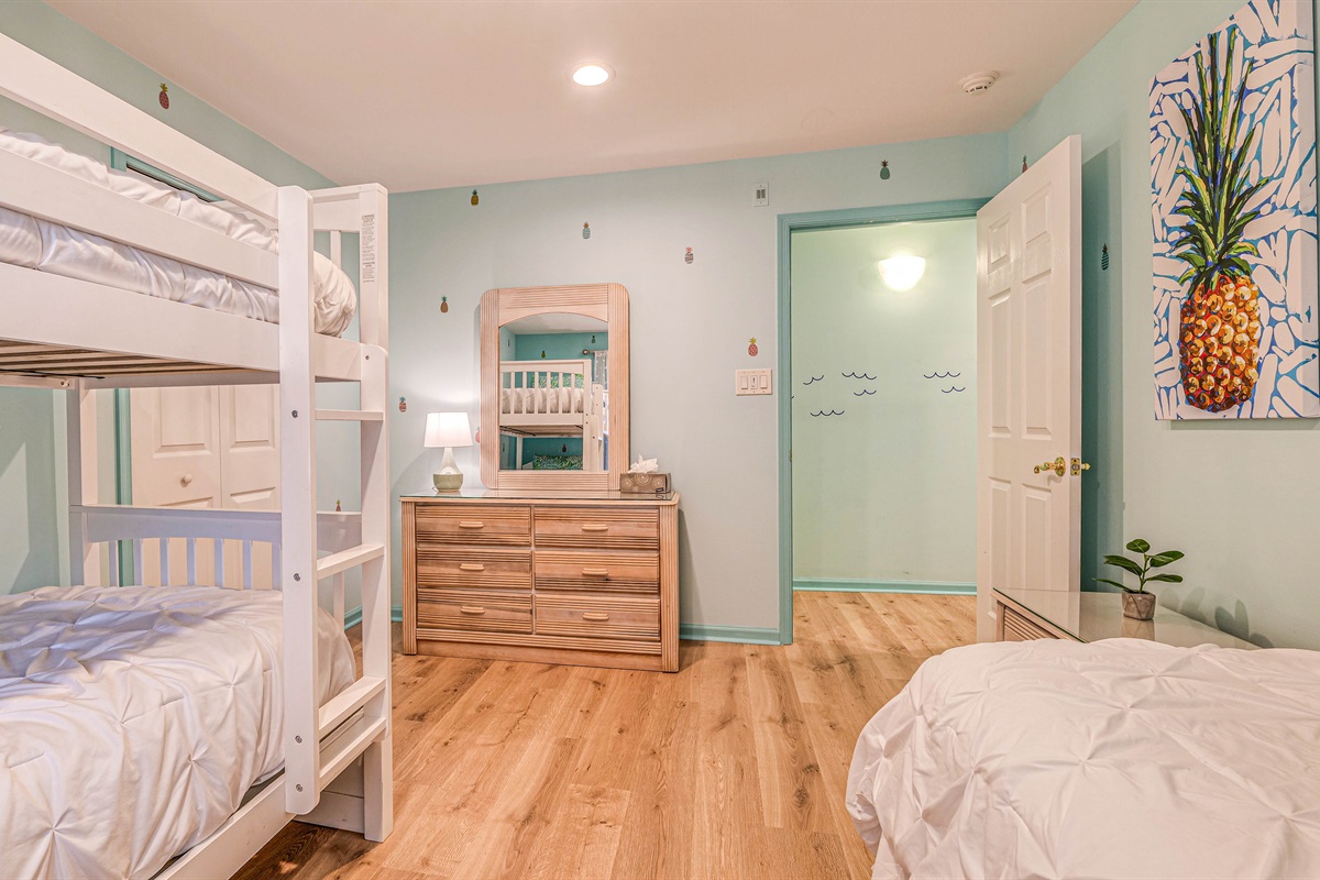 With a dresser and vanity area
