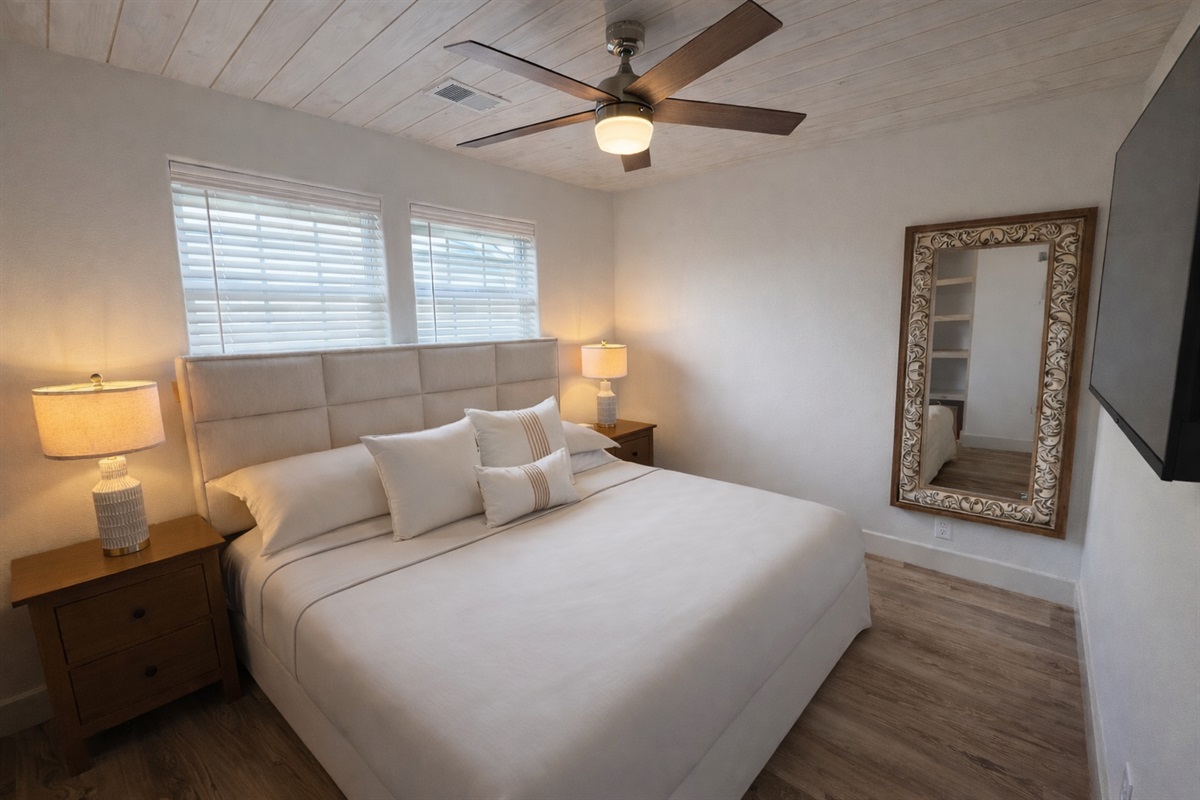 Secondary bedroom with king bed and smart TV
