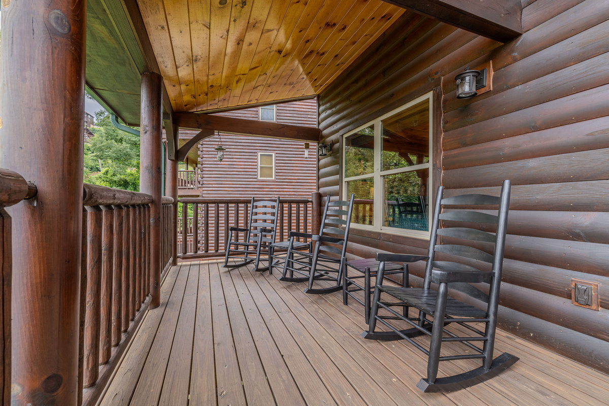 The Skyline Deck offers covered outdoor seating for morning coffee, evening drinks, and peaceful Smoky Mountain views.