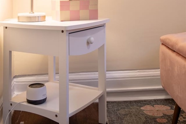Comfortable queen-sized bedroom offering a restful retreat with ample space and natural light.