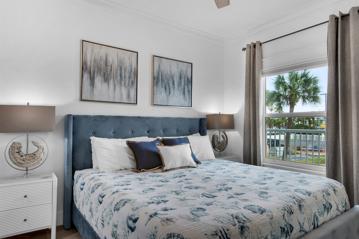 Primary bedroom with balcony access