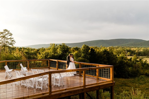 Event couple enjoying sunset views from the deck.
