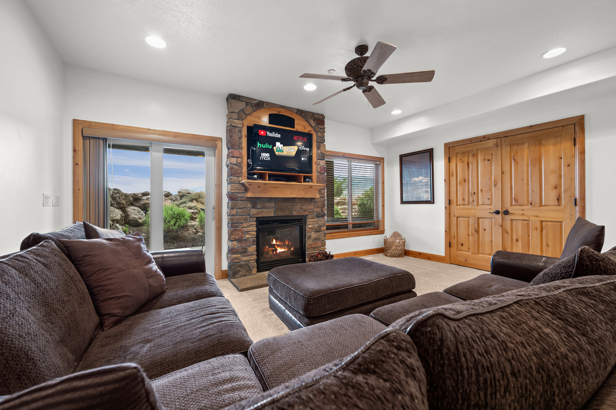 Spacious lower-level family room gives your group a second gathering space with its own fireplace and TV.