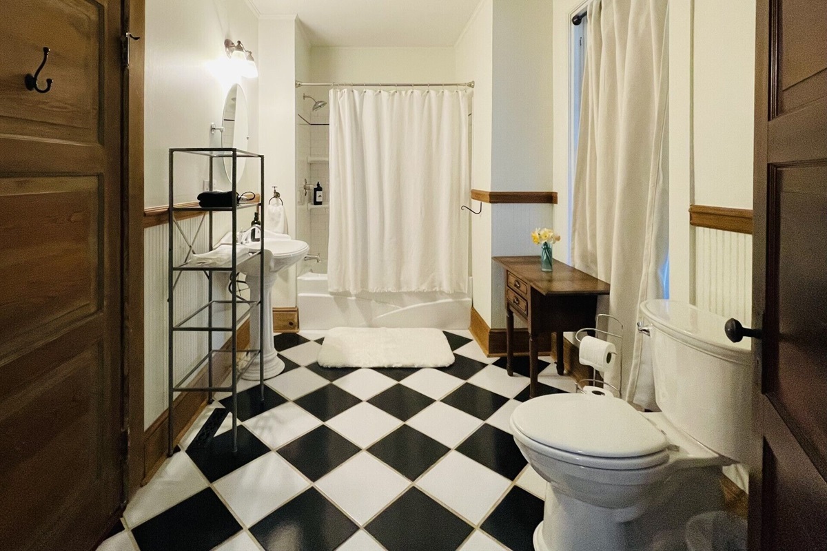Downstairs bathroom that has a tub/shower combo