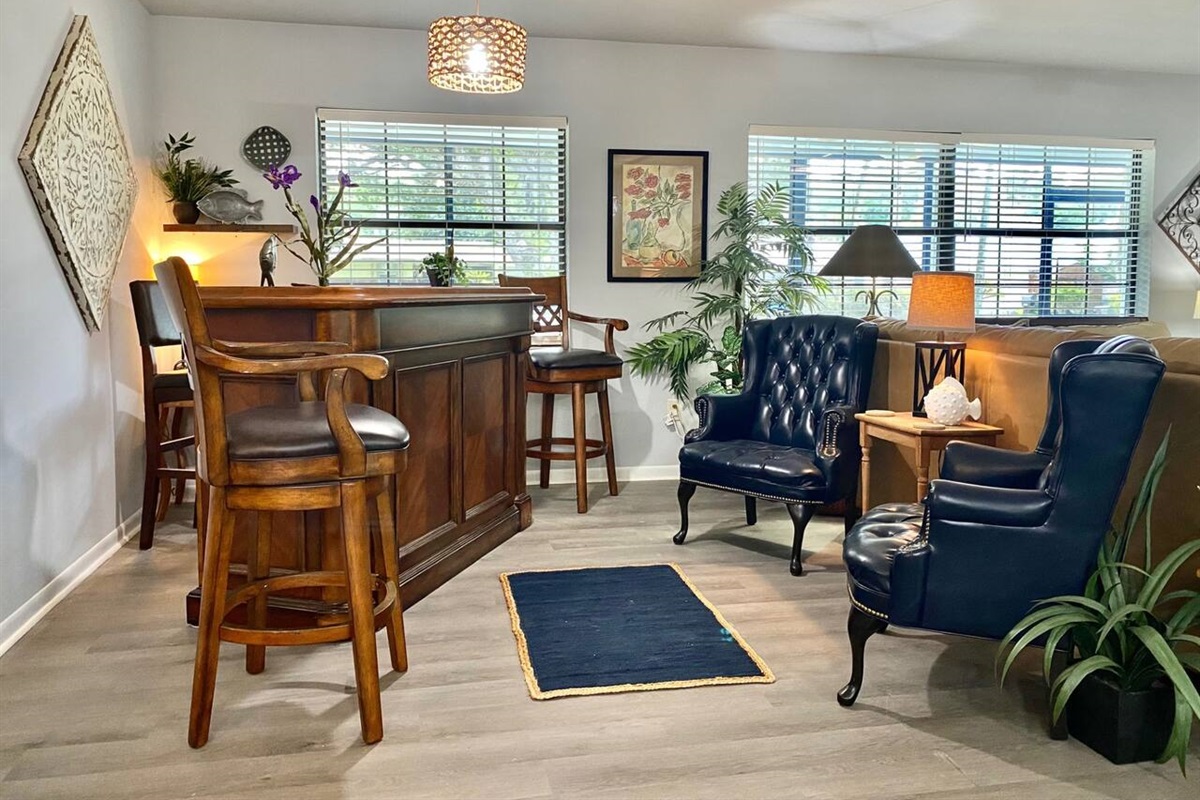 Bar and lounge area in the living room to enjoy a night cap or just have meaningful conversation in this inviting space.