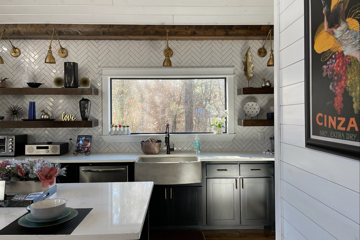 Concrete farm sink, plenty of counter space and abundant lighting - just to name a few of the special touches in the kitchen (and beyond!)