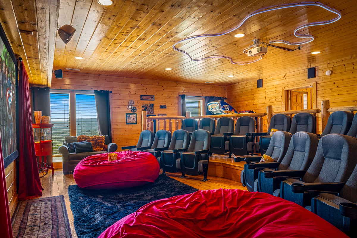 Our private theater room with tiered seating, recliners, and bean bags—perfect for movie nights