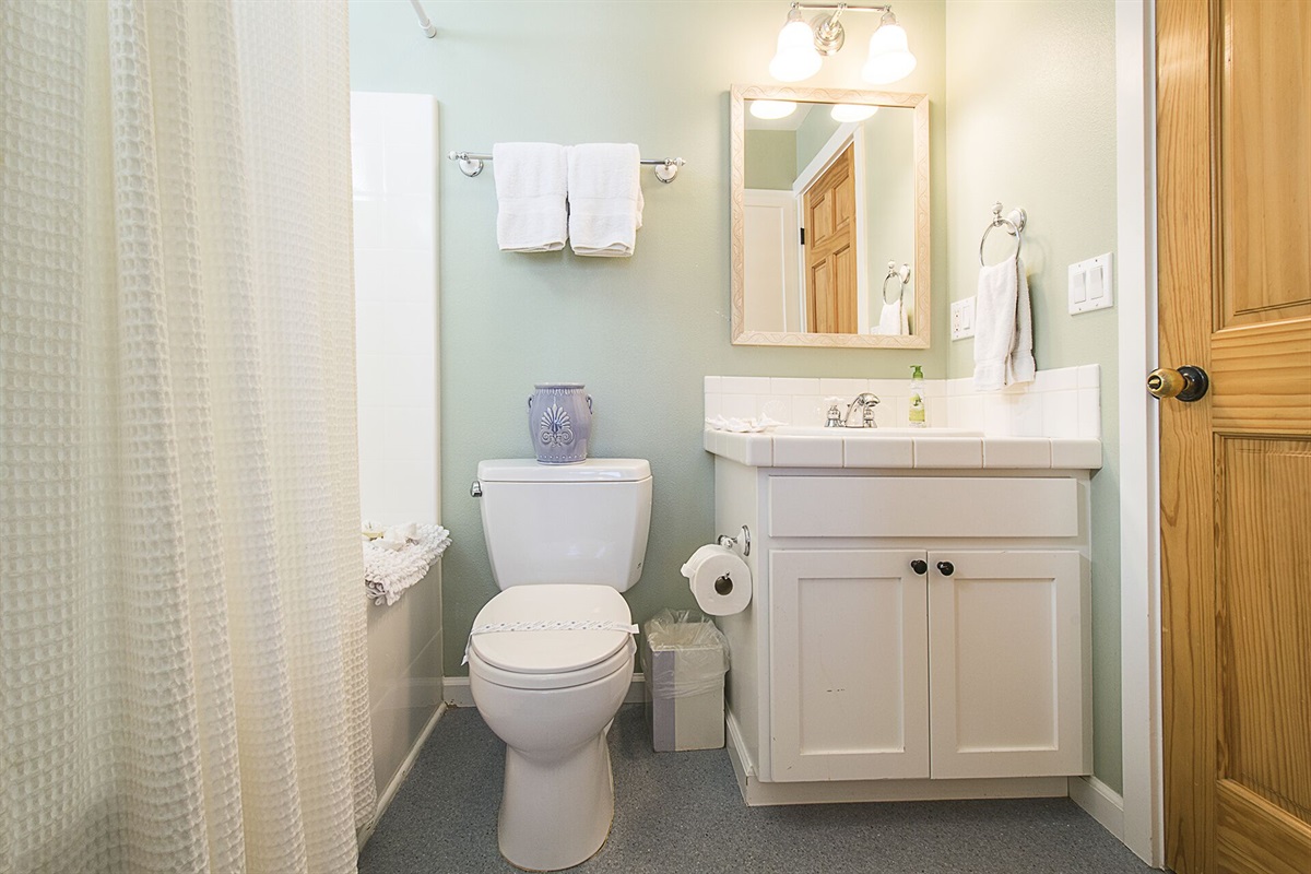 Enjoy easy access to a shared bath from the queen bedroom or hallway, designed for comfort and convenience.