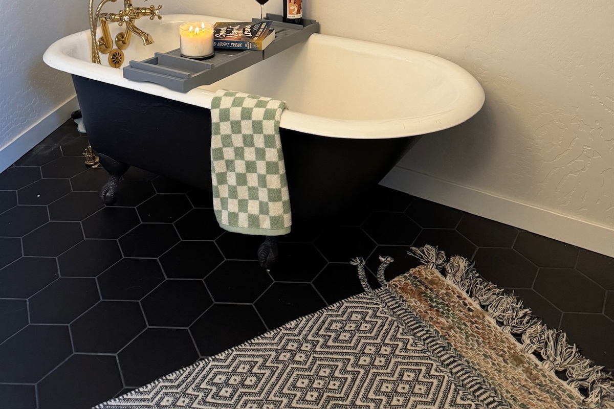 Clawfoot soaking tub in primary bathroom