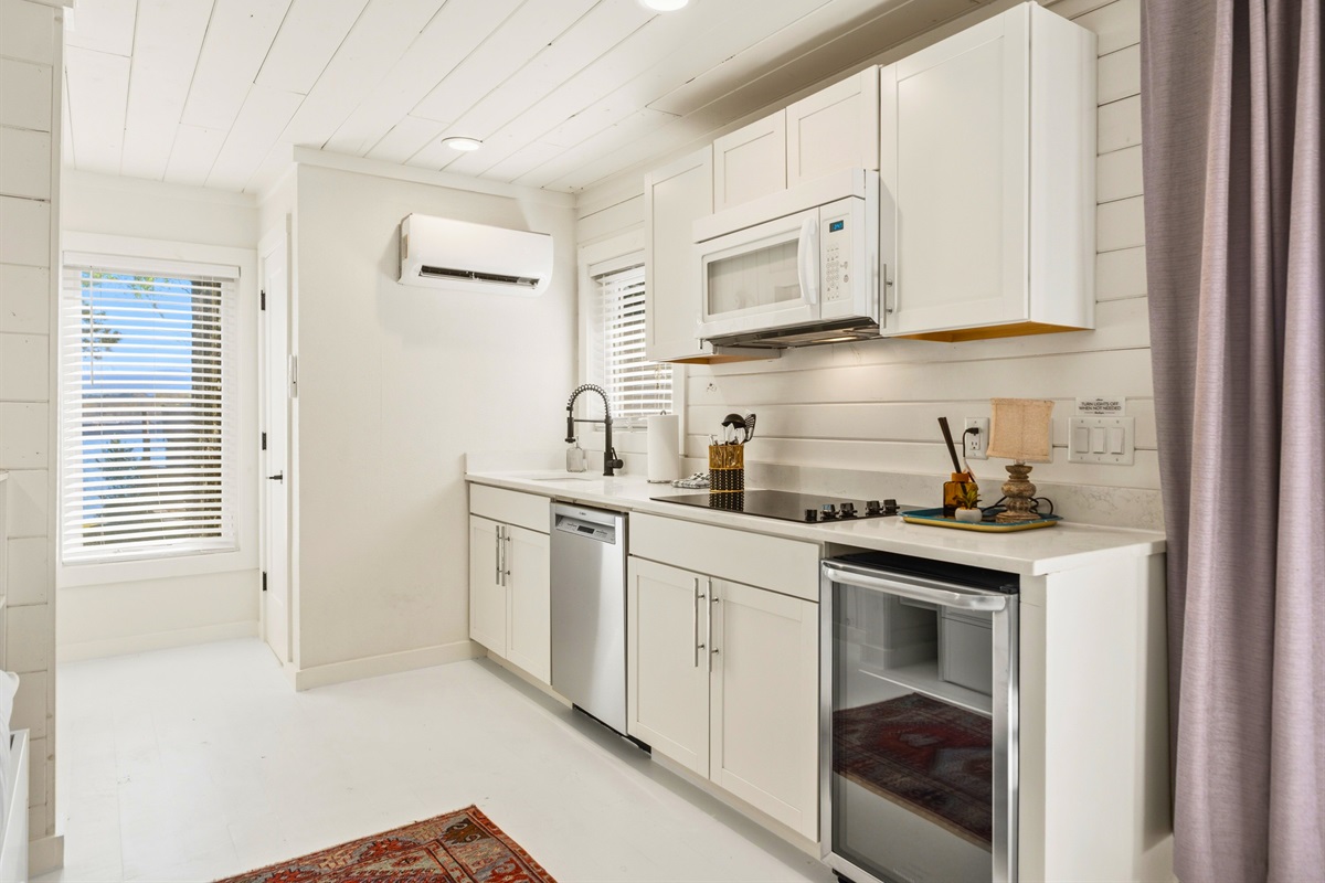 Prepare meals in the cabin kitchen where a bright, clean design and modern appliances make cooking simple and enjoyable.