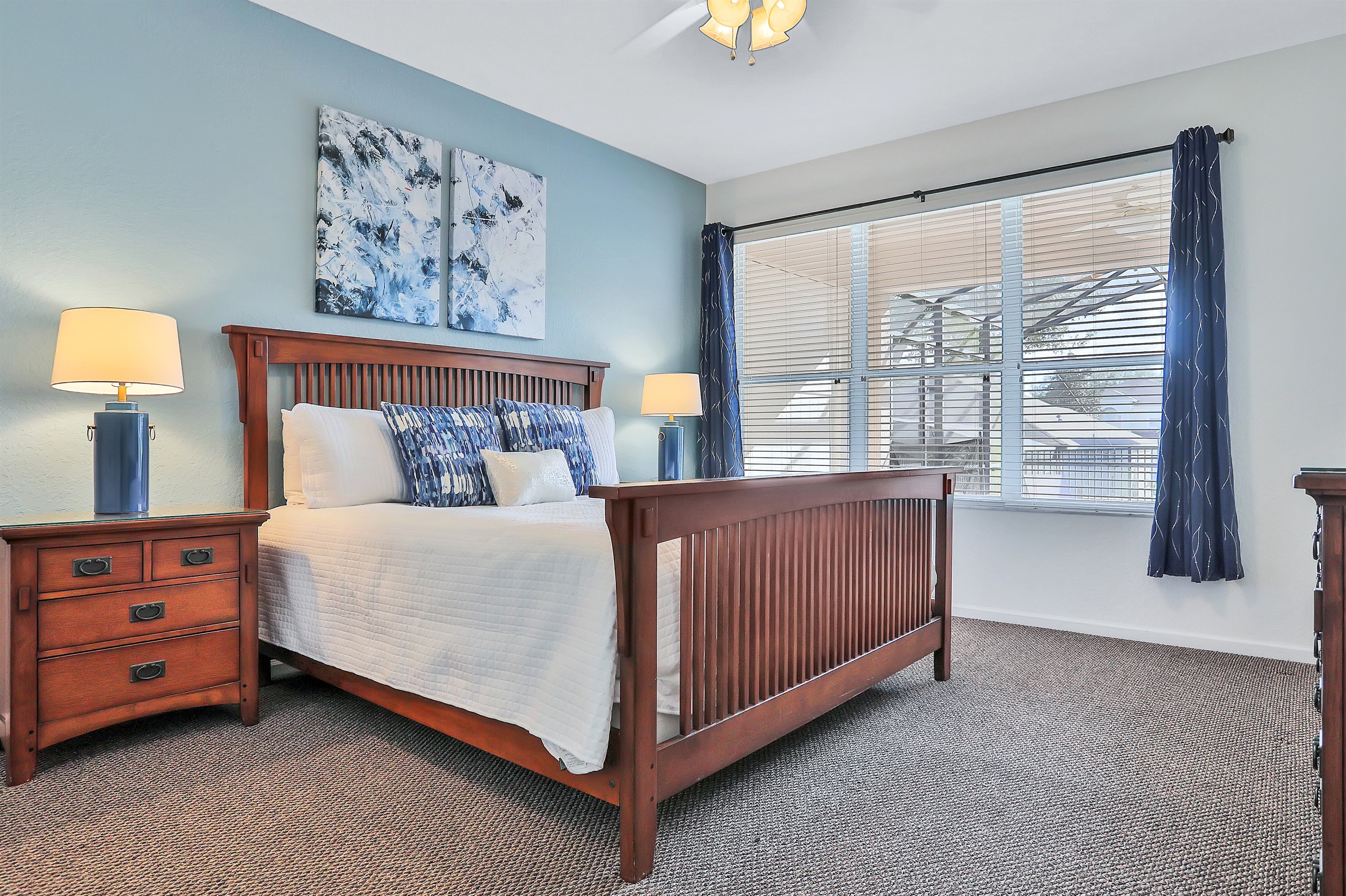 Primary King bedroom suite with 55" TV. Now with luxury vinyl flooring.