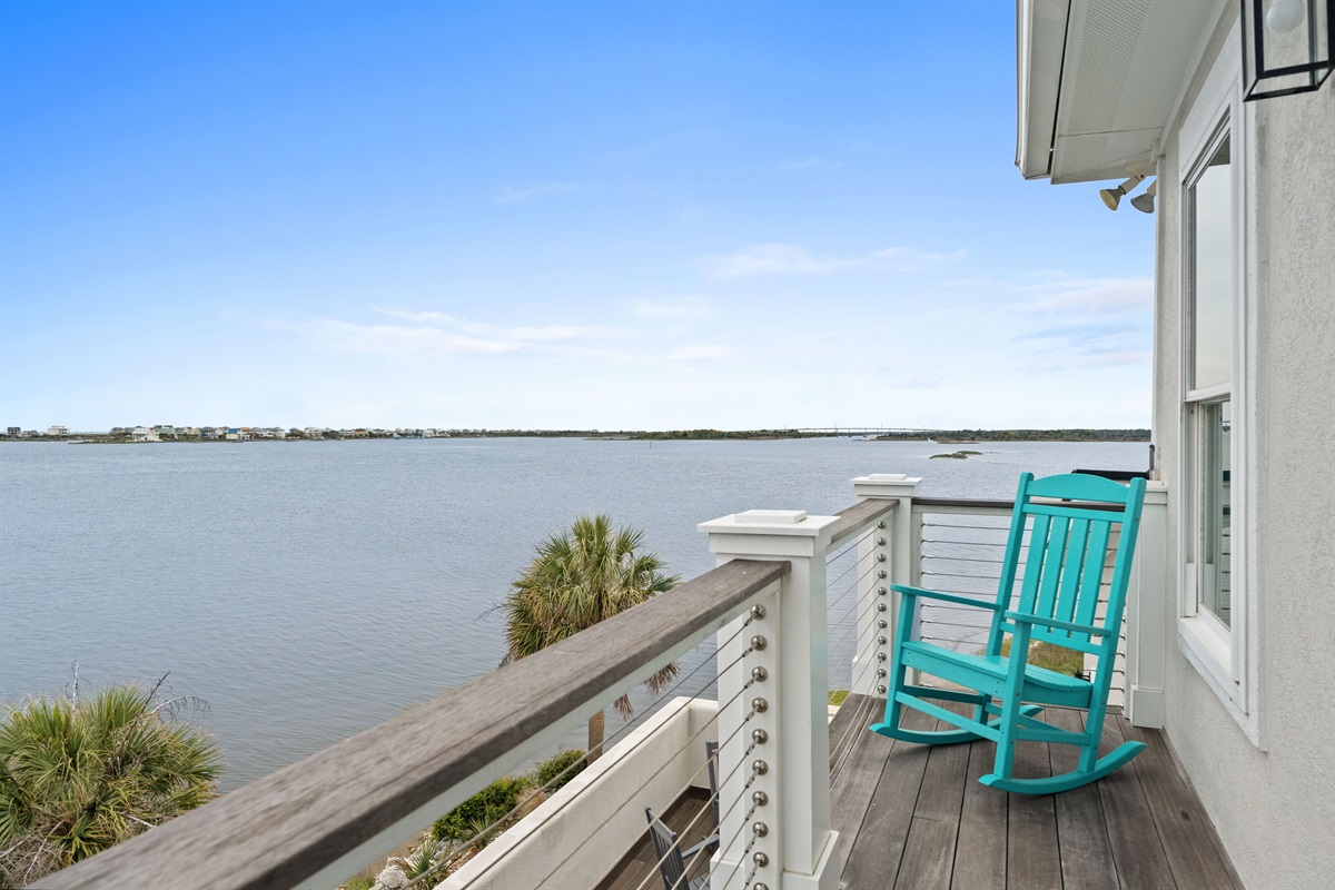 Enjoy peaceful morning coffee from the balcony&rsquo;s rocking chair with stunning waterfront views
