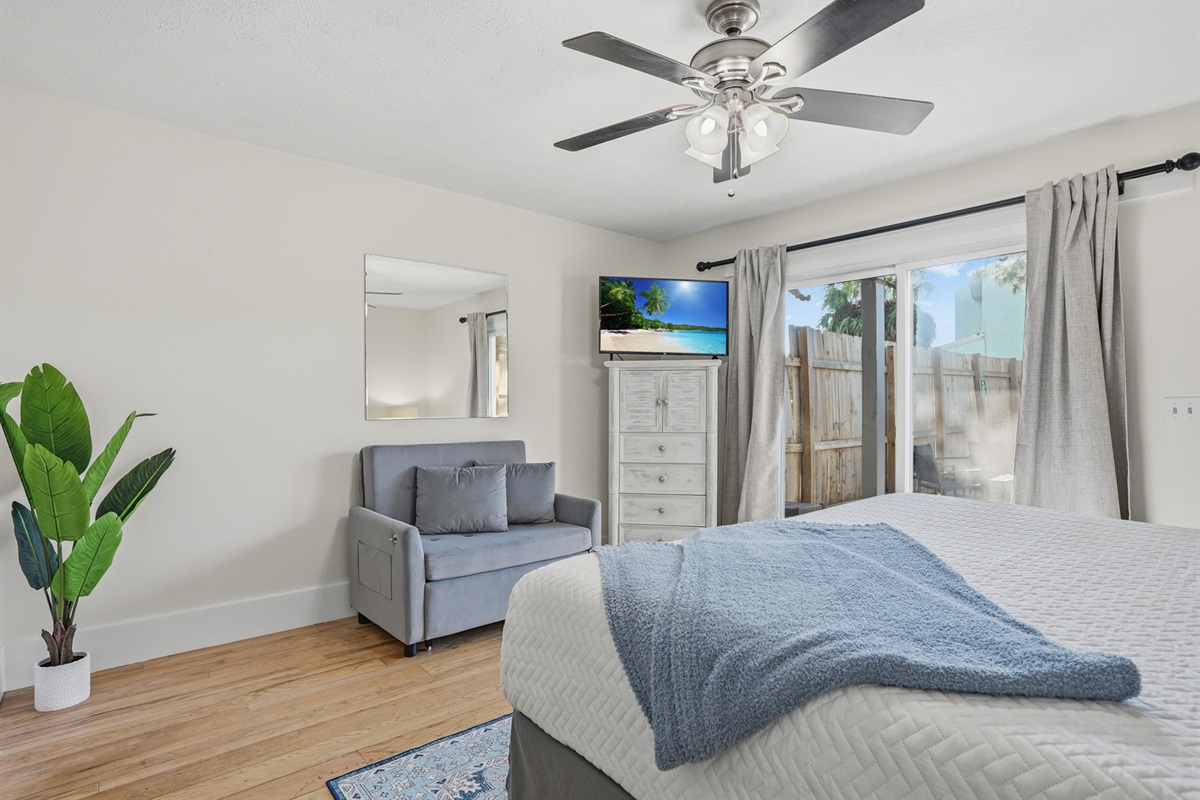 Bedroom # 2 is Downstairs with King Bed and Access to Backyard