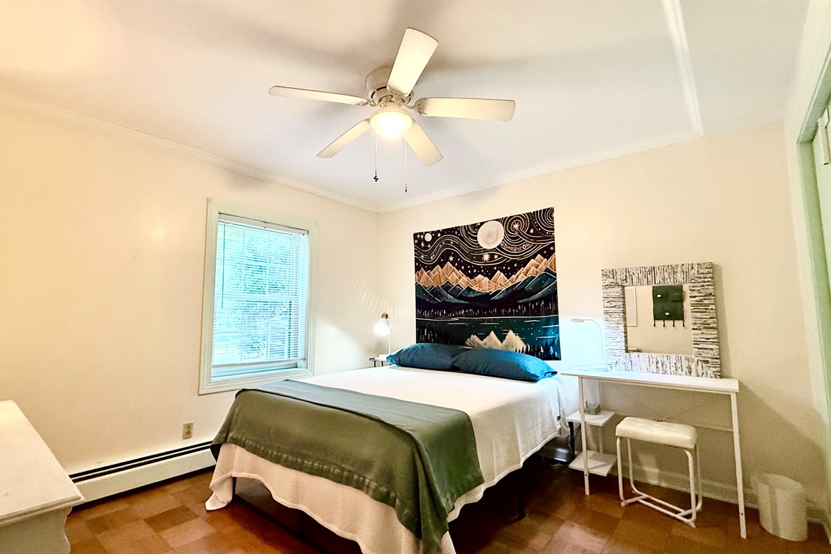 Bright and airy bedroom in the lower level of the house