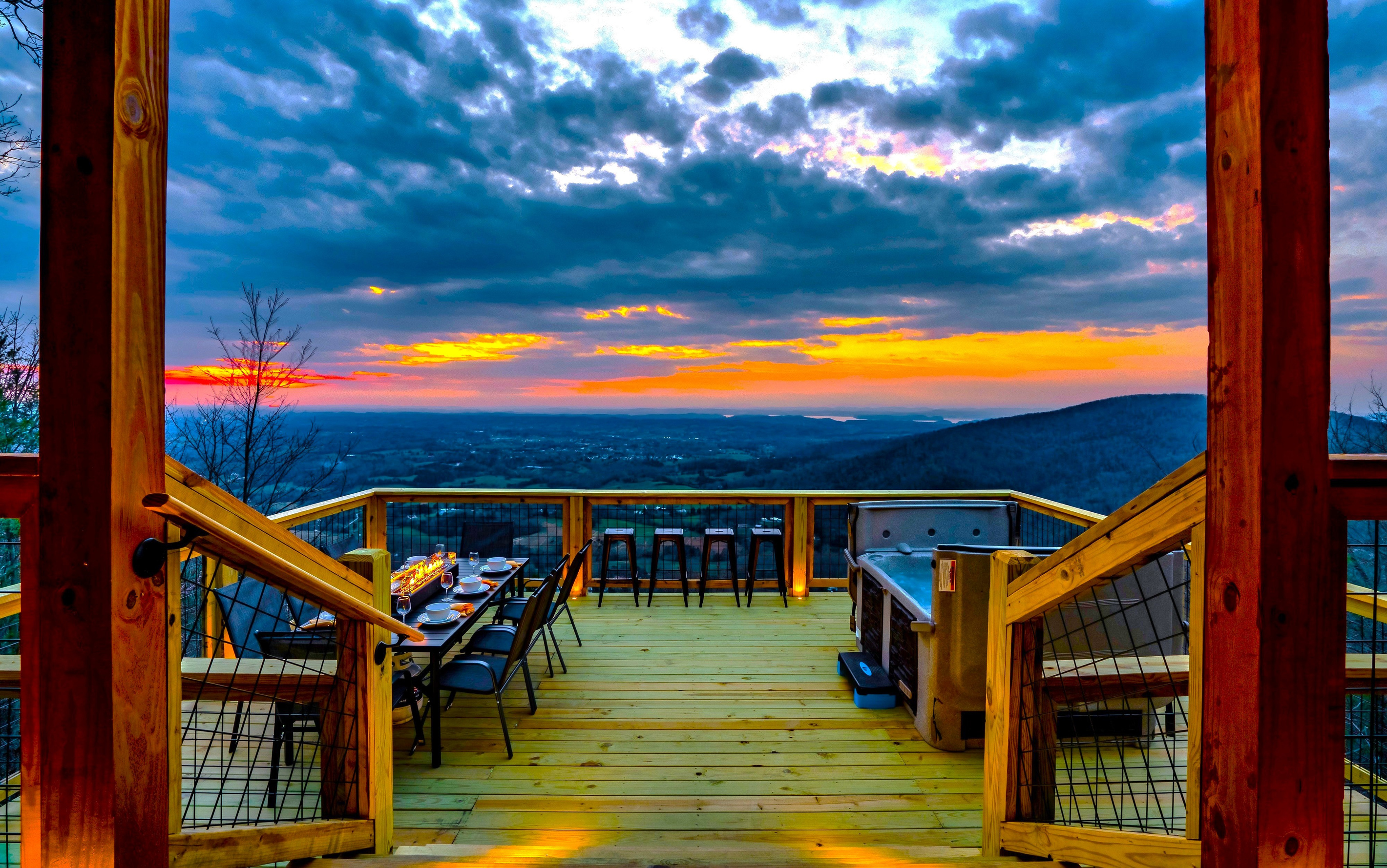 Escape to "Chasing Sunset" Cabin where our guests enjoy sweeping and breathtaking panoramic long range mountain views, glowing sunsets, and intimate sparkling city lights at night.