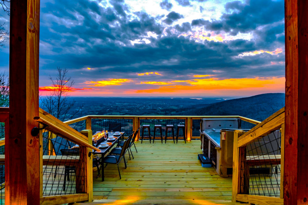 Escape to "Chasing Sunset" Cabin where our guests enjoy sweeping and breathtaking panoramic long range mountain views, glowing sunsets, and intimate sparkling city lights at night.