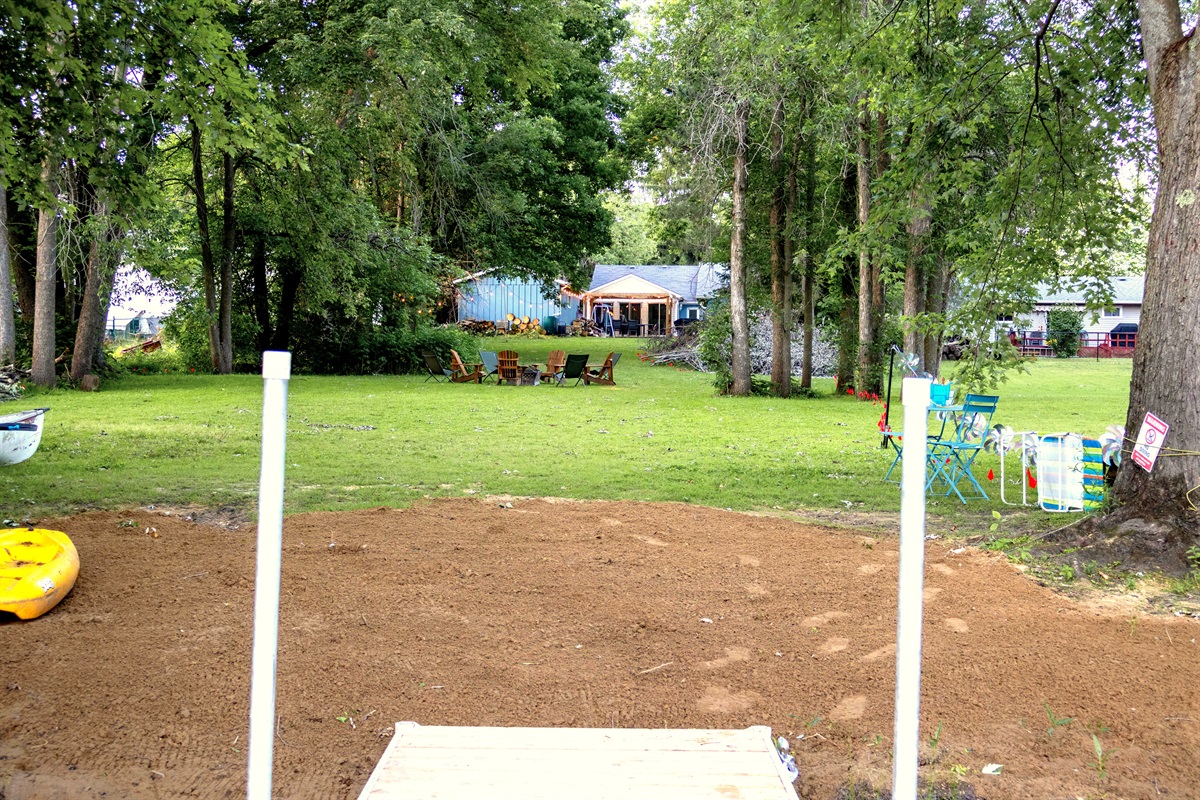 Beach, lots of green space and Adirondack chairs ready for stories by the fire. Cottage in the background — this is what summer evenings are made of. Just add family.