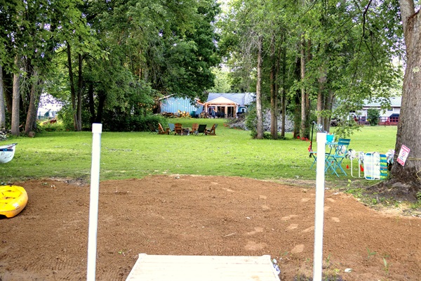 Beach, lots of green space and Adirondack chairs ready for stories by the fire. Cottage in the background — this is what summer evenings are made of. Just add family.