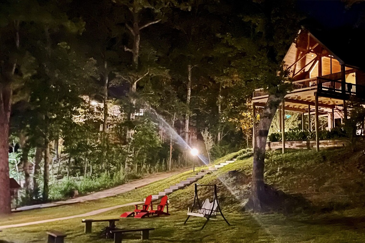 Night pic from the lower yard.   Firepit, benches, & Adirondack Chairs. 