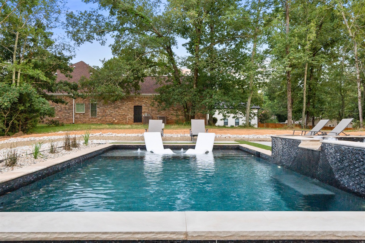 Cool off and relax in our refreshing pool, just steps away from the lake, providing a tranquil setting for your stay.