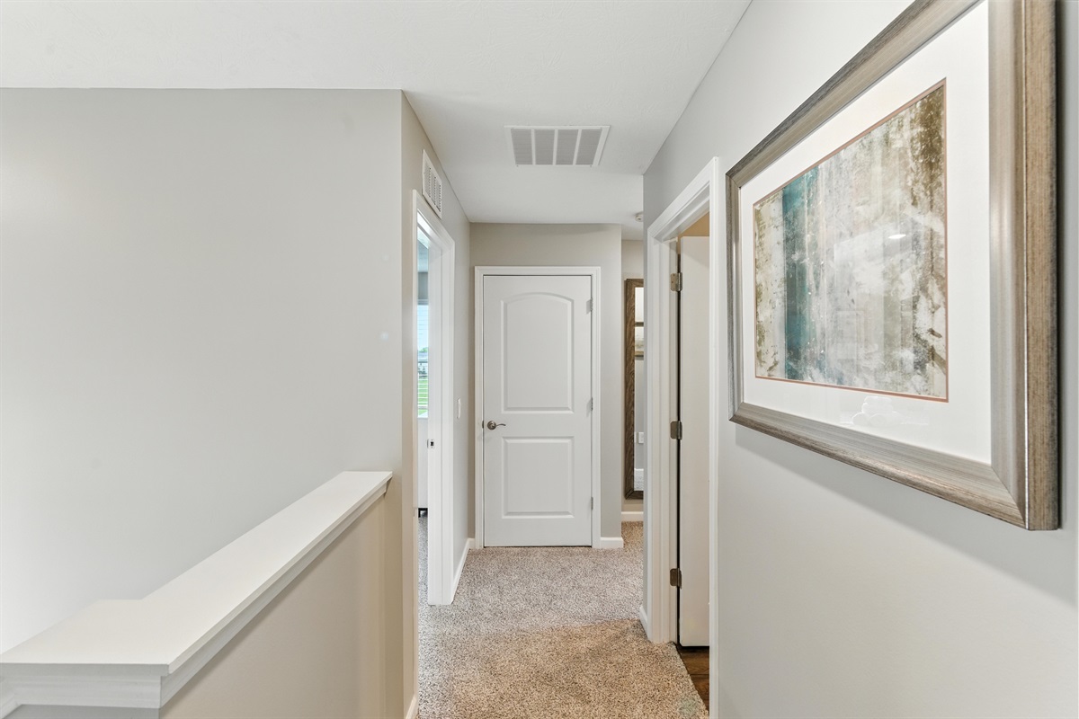 Spacious hallway leads to cozy, private rooms