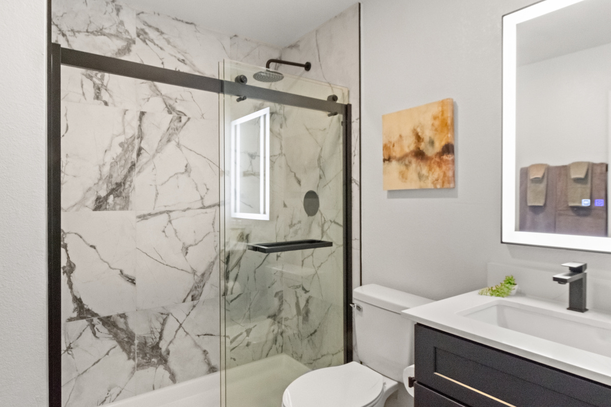 Clean, spacious bathroom designed for a relaxing and refreshing stay.