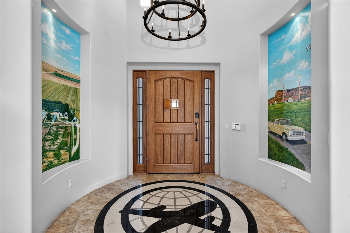 Grand entry foyer with custom wood door and elegant finishes sets the tone for your private luxury desert retreat