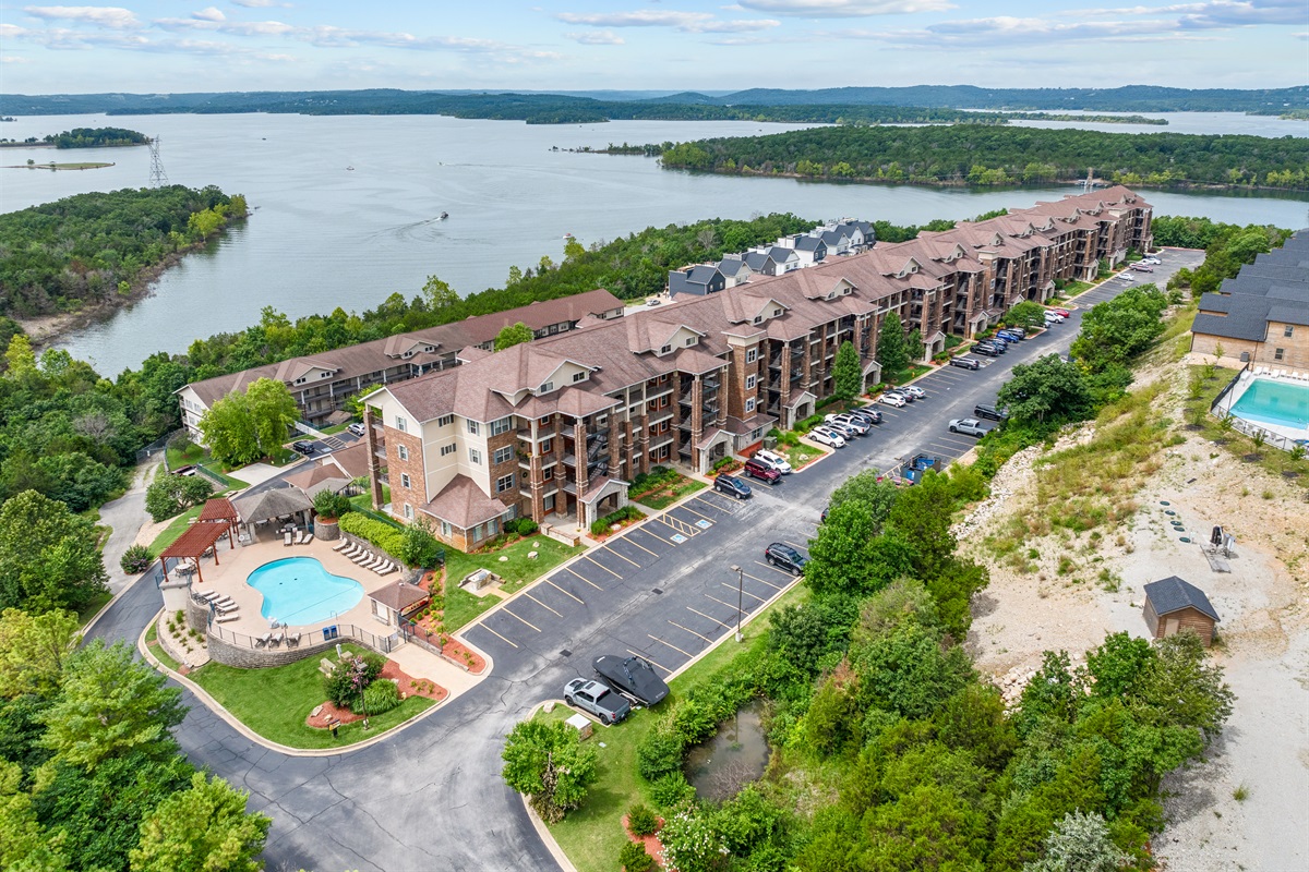 Another broad look at the building’s scenic perch above the water and Ozark hills.