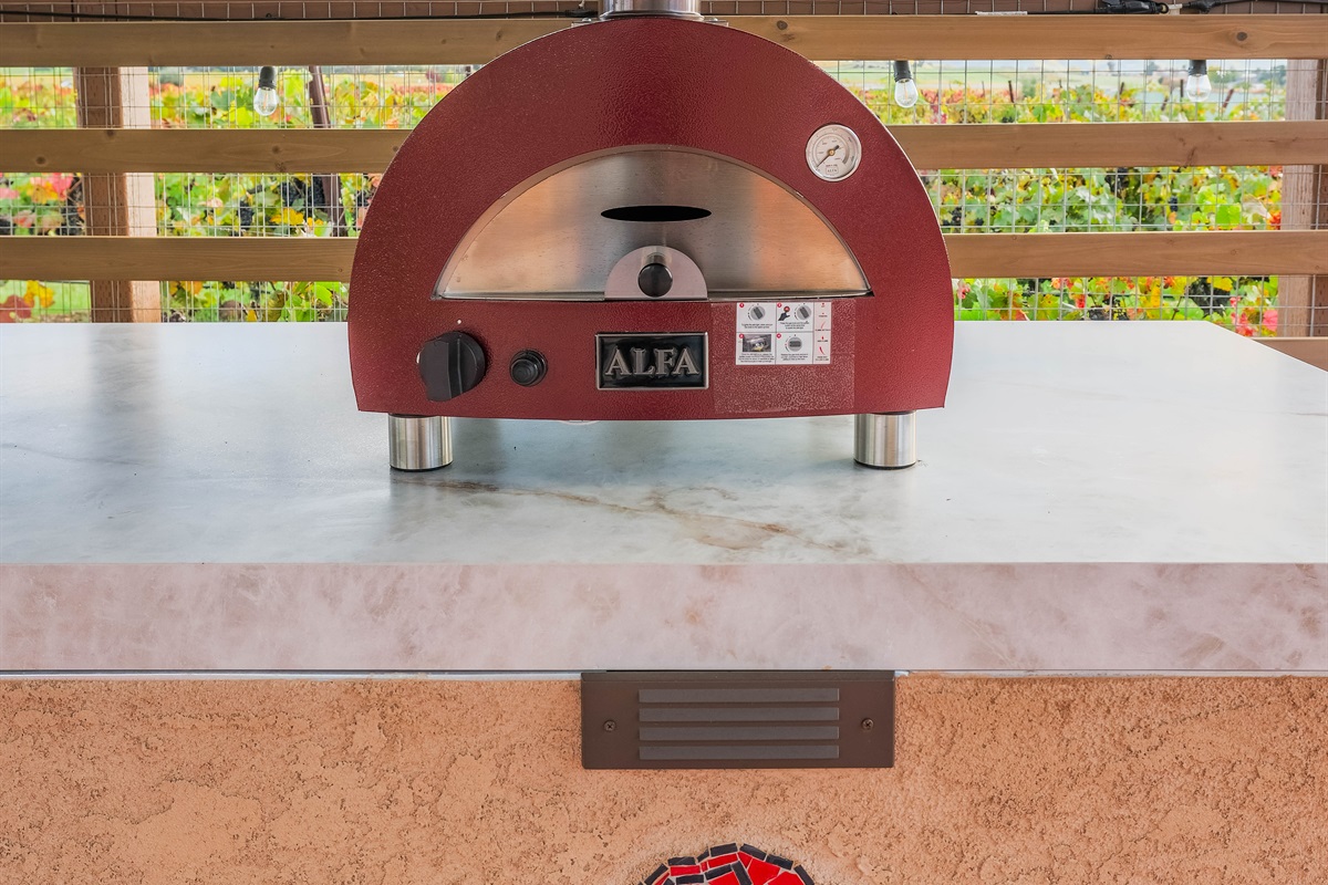 Make our own pizzas in our outdoor pizza oven.