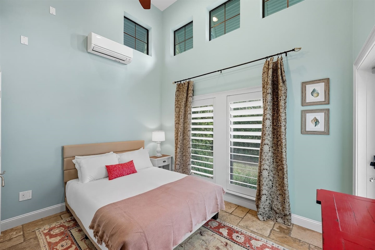 Downstairs guest bedroom with queen bed