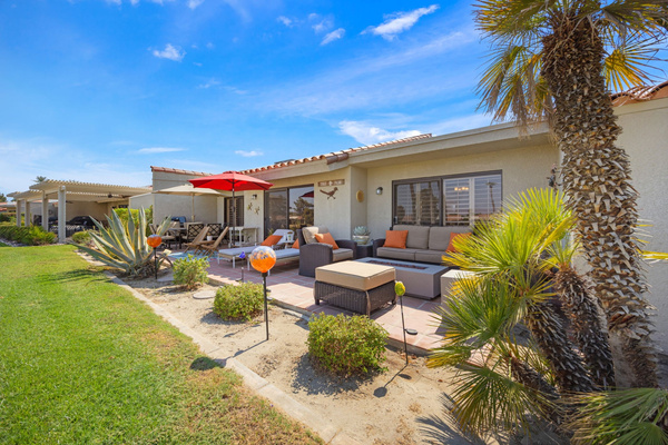 Spacious back patio with ample seating