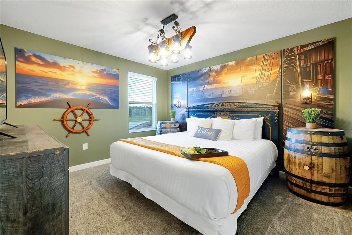 Set sail aboard your own ship in our Pirates of the Caribbean themed room. Enjoy the antique (head board) and rustic touches (whiskey barrel nightstands) as well as some beautiful water views (lake views).