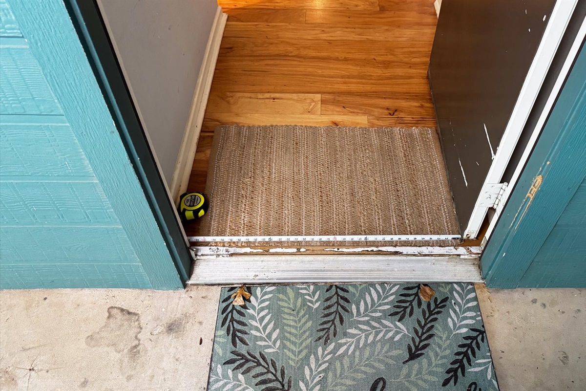 Step free from the carport into the house.