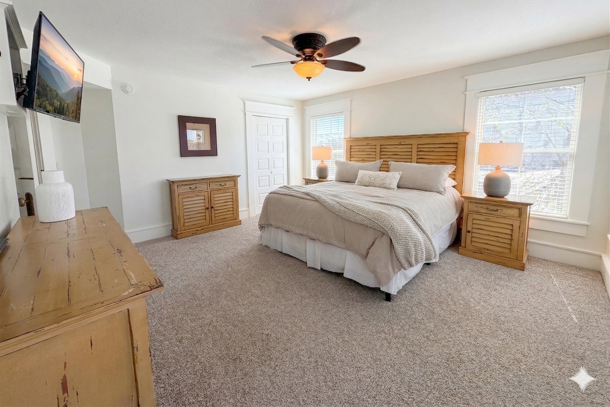Bedroom 3 — Elegant King Bed with Decorative Headboard & Warm Tones | Luxury Accommodations at The Mark Twain, Outer Banks