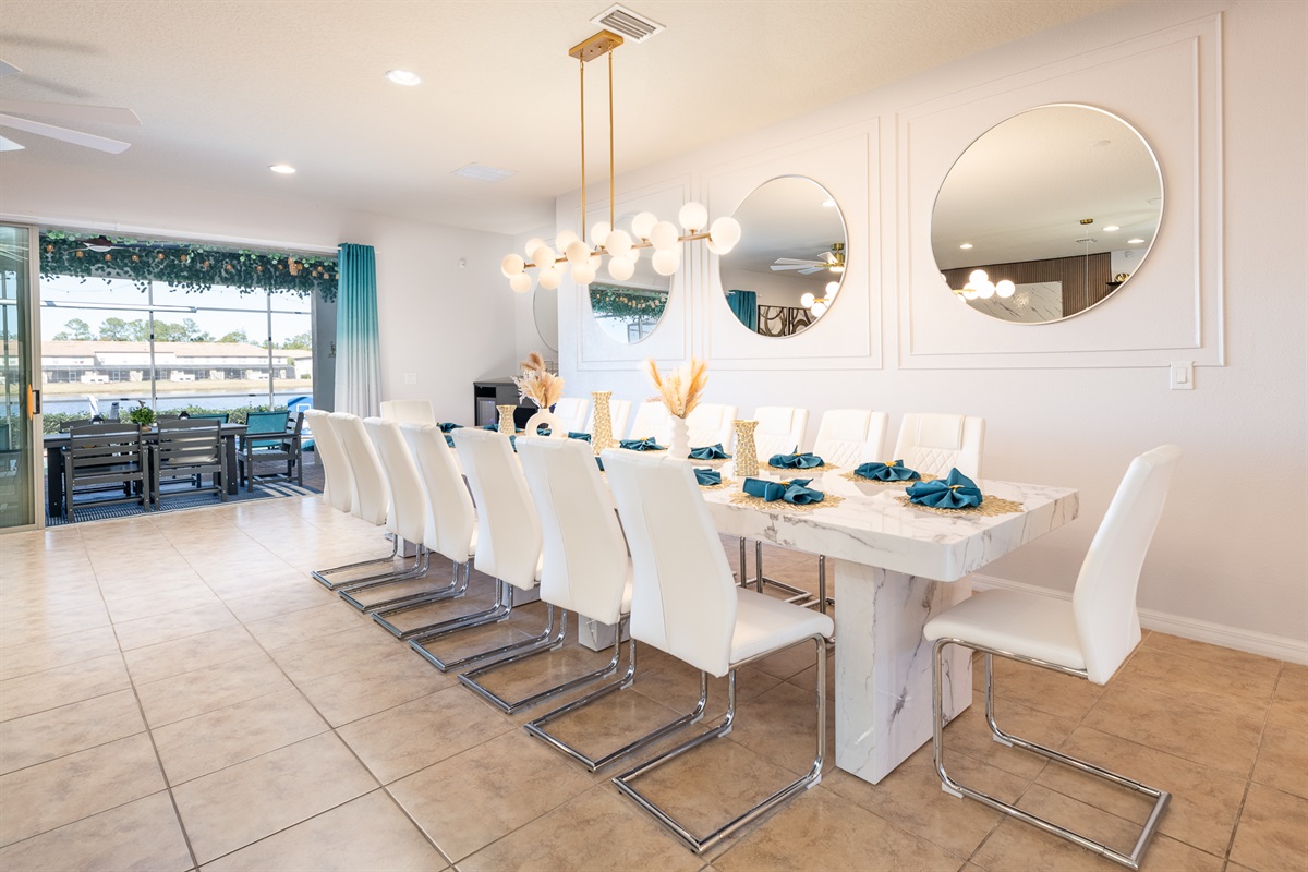 Dining table with 16 chairs plus an additional 4 at the island bar