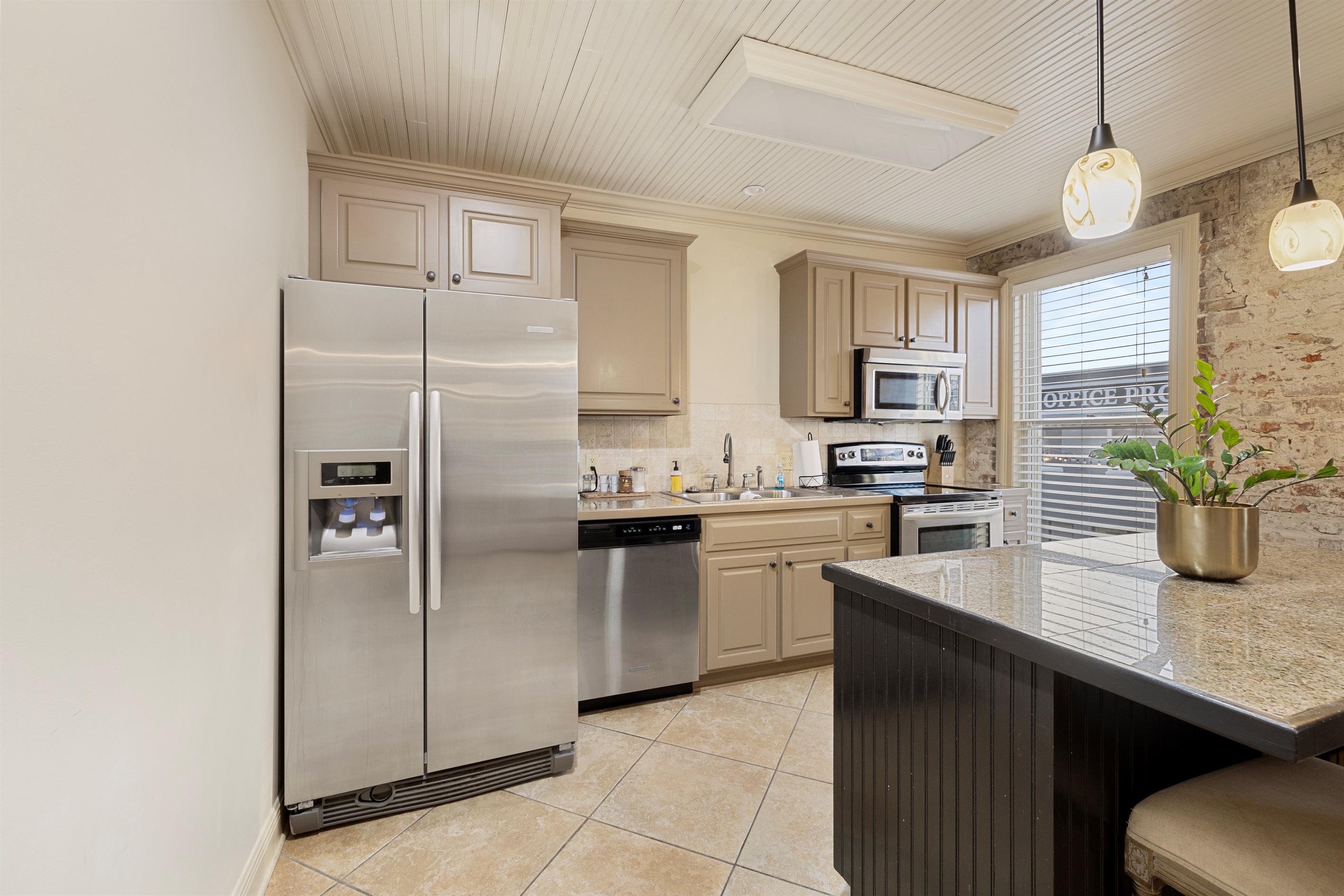 Modern appliances and chic decor make cooking a delight in this vibrant space