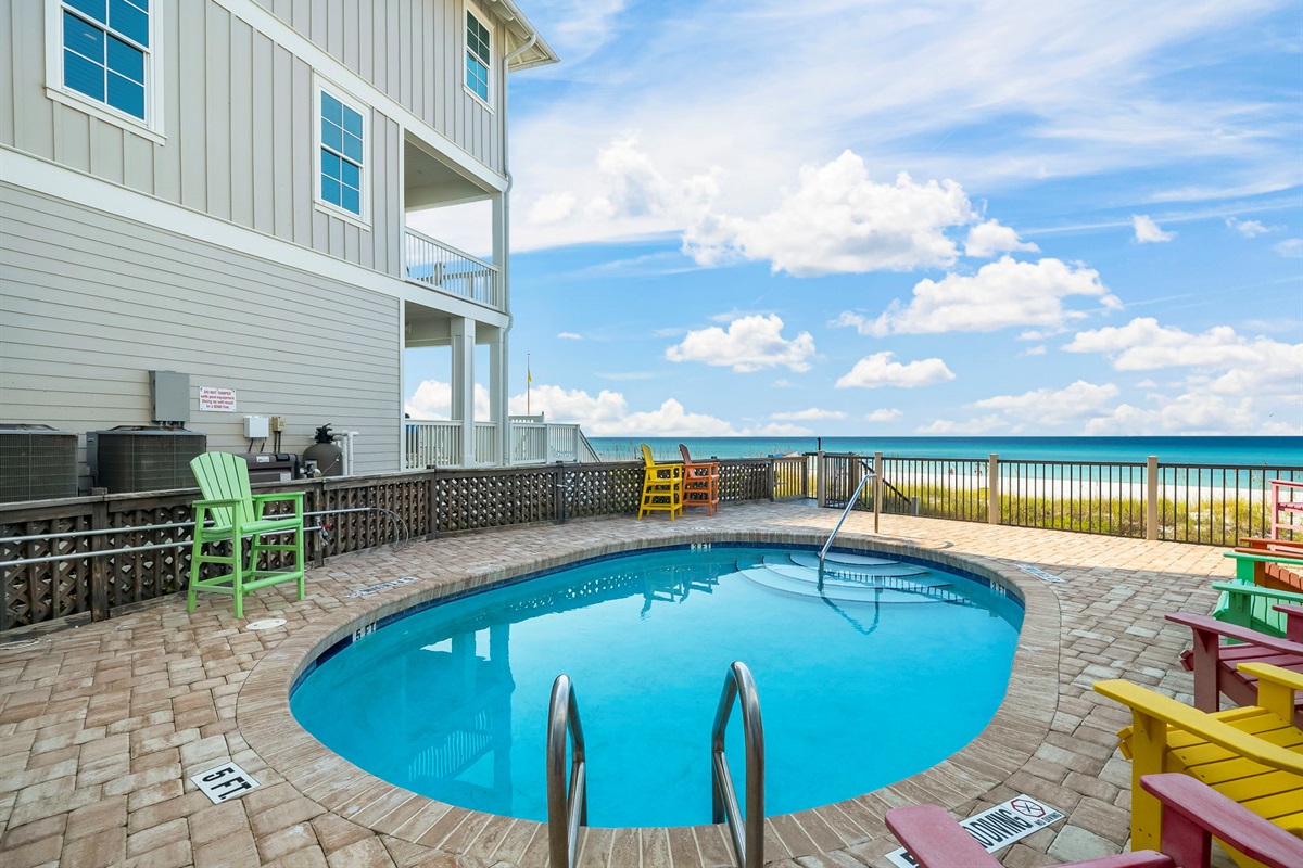 Swim, sun, or stroll: enjoy the shared beachfront pool, sundeck, outdoor shower, and private boardwalk to the sand — plus a shared grill for those perfect cookout nights.
