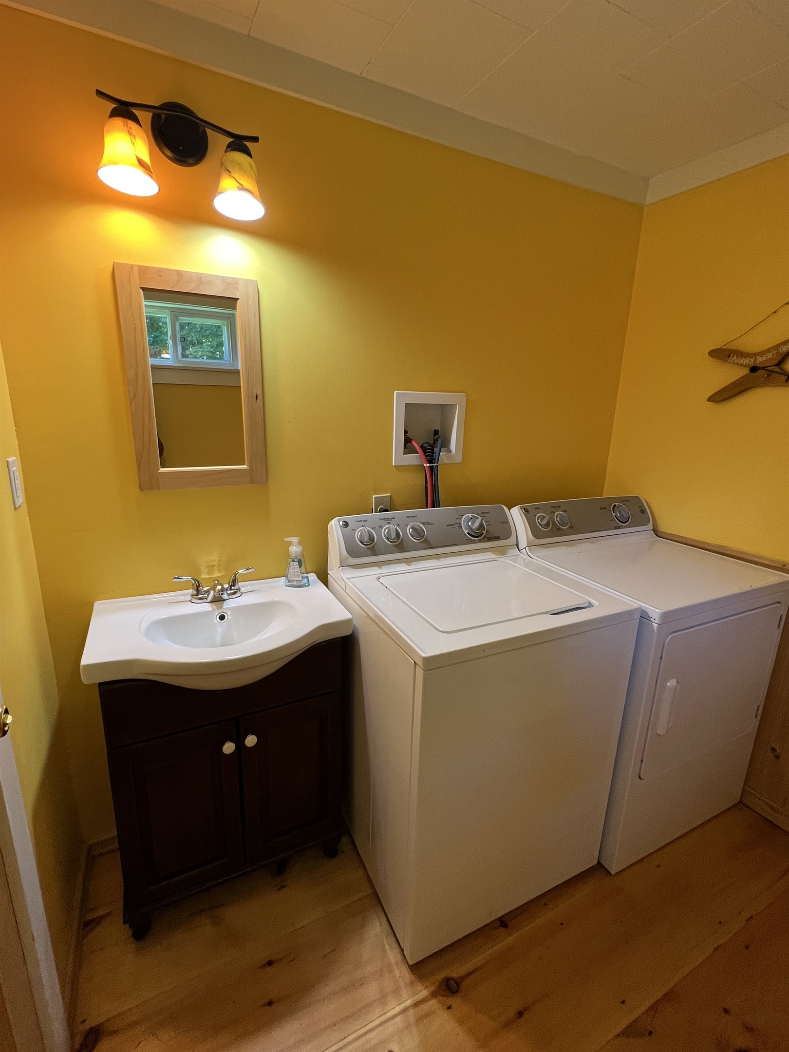 Powder room and laundry right off the Kitchen.