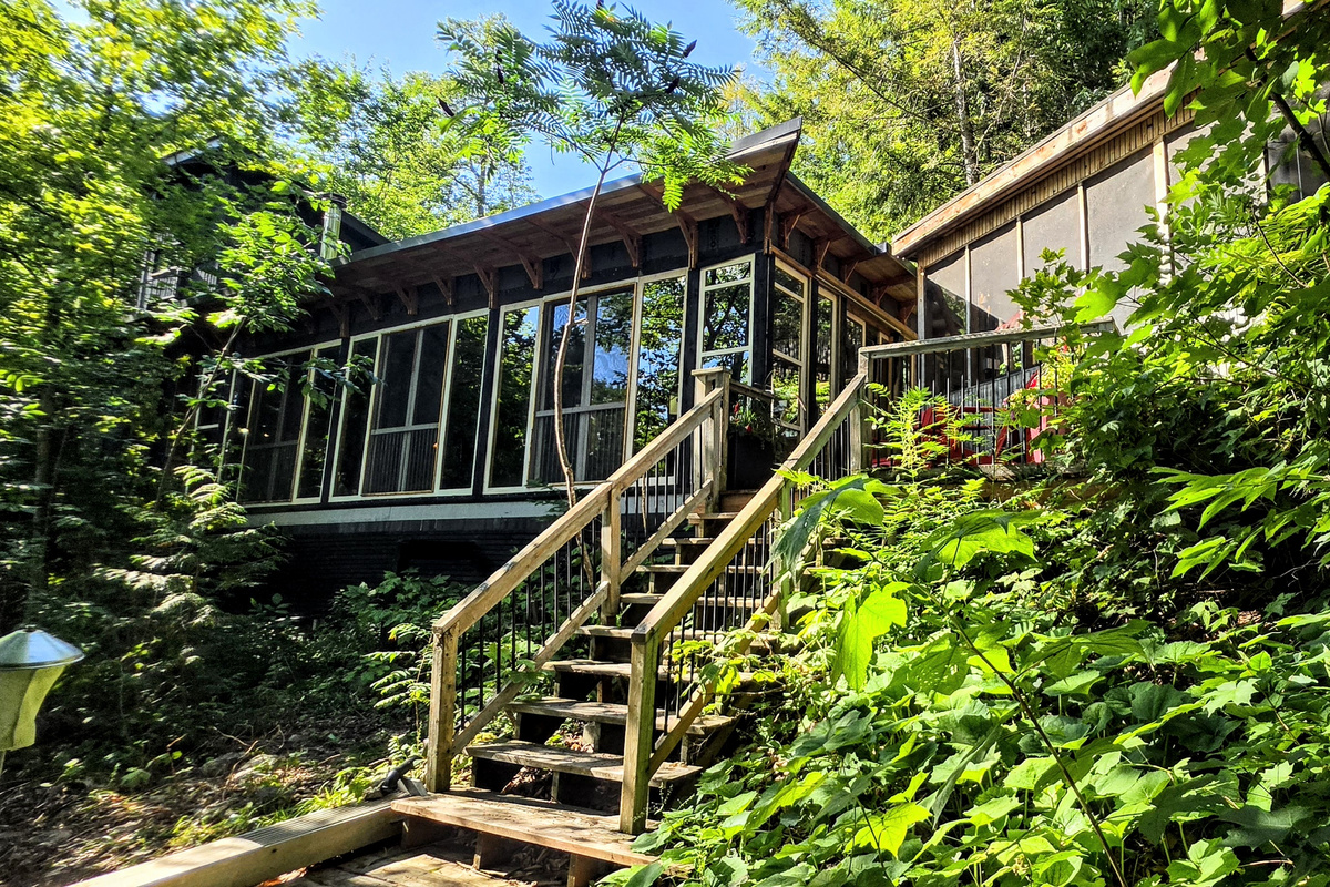 Veranda to the left; Smoke House to the right from fire pit area