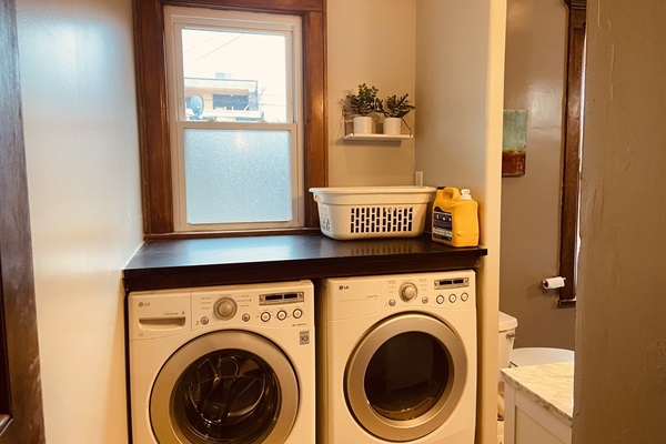 Laundry facilities in the bathroom.