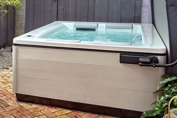 Relax and unwind in our luxurious custom Bullfrog spa, perfectly nestled on a private patio designed for your complete comfort and enjoyment.