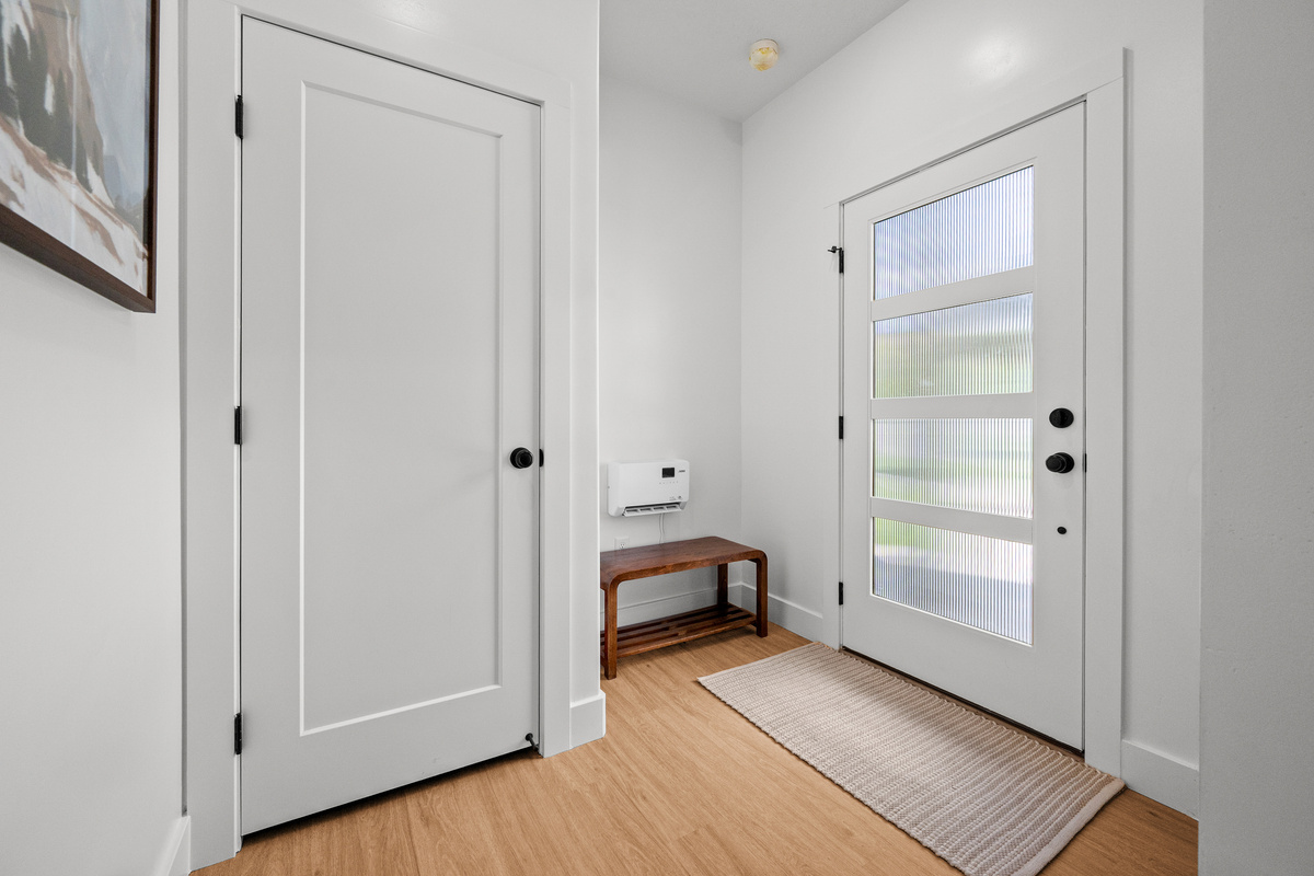The bright entryway offers an easy transition into the home with space to settle in when you arrive.