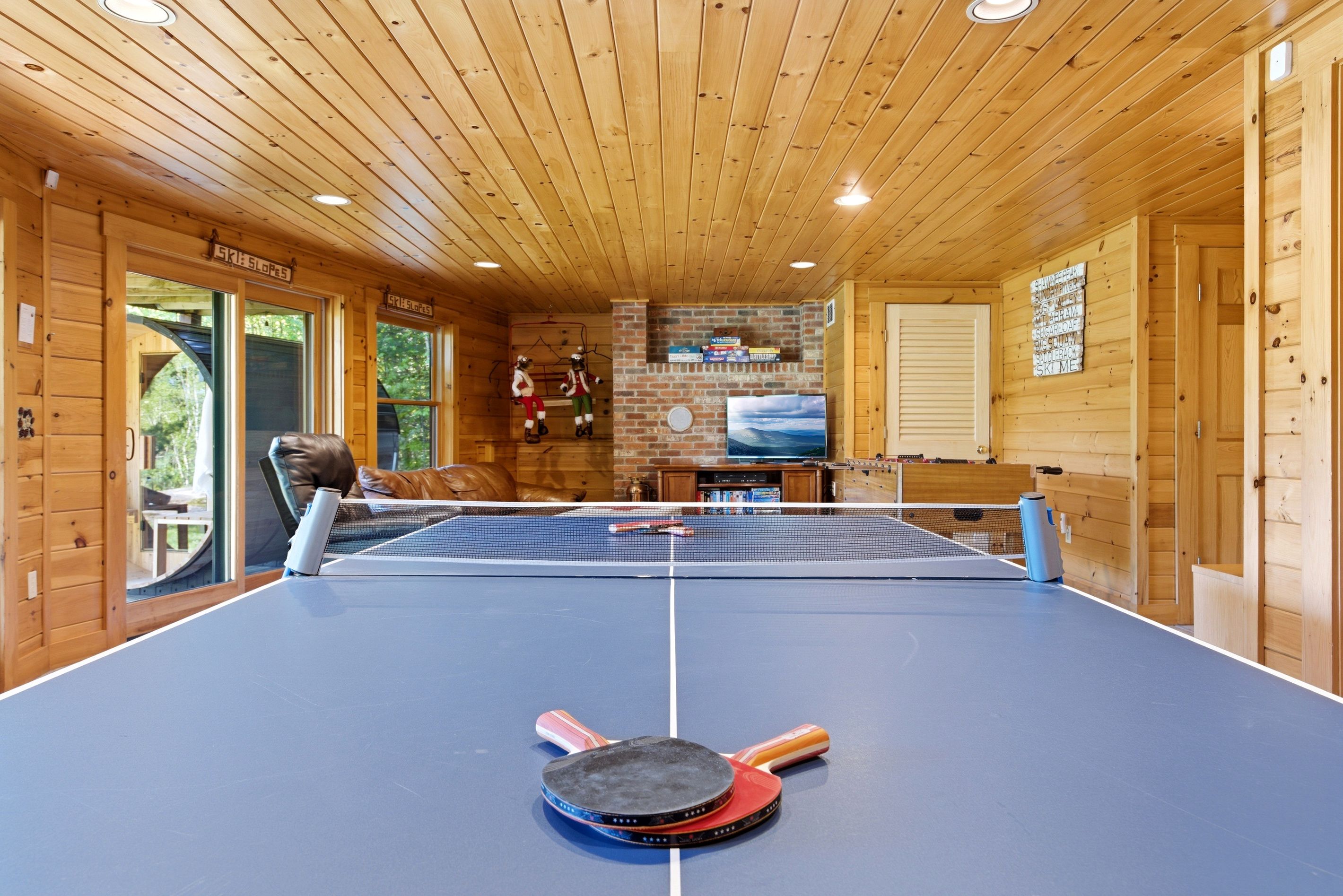 Serve up some fun with a full-size ping pong table for guests of all ages.