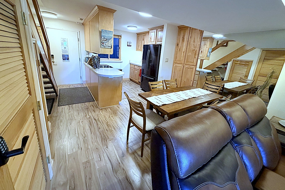 New wood flooring throughout the living room, kitchen, dining area, and bathroom—fresh, warm, and inviting!