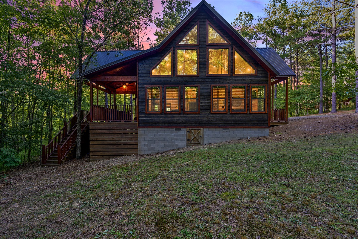 Picture windows through out the cabin make you feel tucked into the forest.