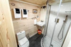 is small but equipped! Brand new stand up shower, toilet and vanity.