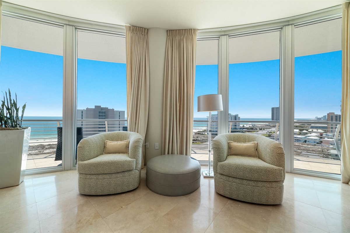 Unwind and soak in the beauty of Ole River and Ono Island from this stunning living room. The expansive windows offer unparalleled views, creating a seamless connection with the surrounding landscape.