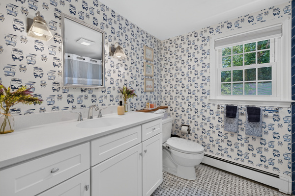Spacious full bathroom with a double vanity for added convenience.