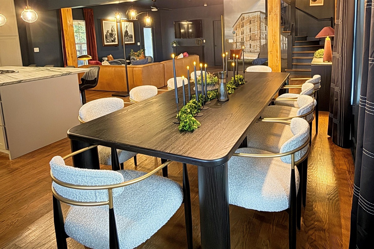 Where form meets warmth — an open-concept design connects kitchen, dining, and living spaces in perfect harmony, wrapped in rich wood tones, soft lighting, and refined textures that define The Rickhouse Retreat’s modern bourbon-country style.