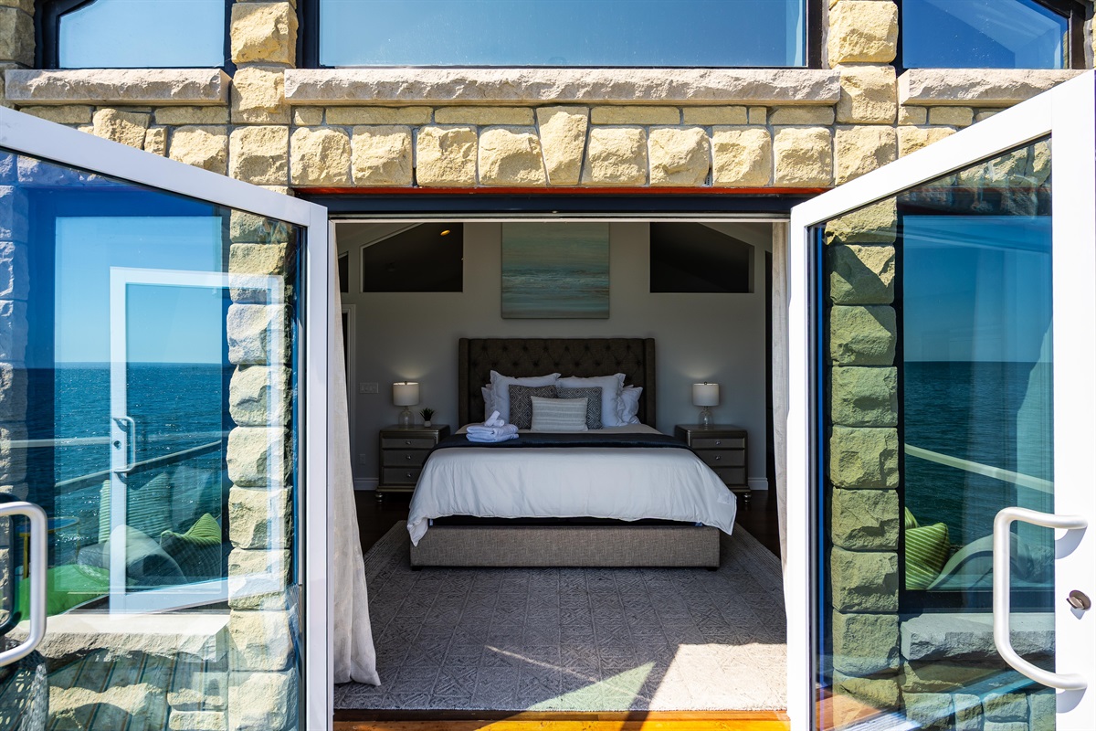 A cocoon of comfort facing the horizon from the private master bedroom balcony.